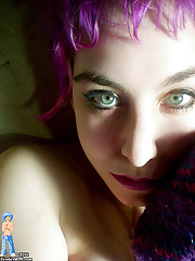 purple haired chick in black fishnet gets naked