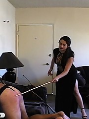 Tough Femdom in black beats him with whips and paddle