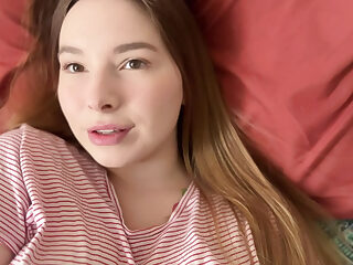 A cute teen girl caresses her sweet pussy in