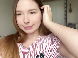 A cute teen girl caresses her sweet pussy in