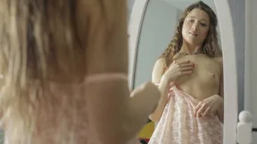 Young Russian woman returns home, feels excitement, and plays with a toy.
