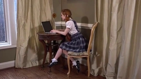 Dolly Little, petite redhead from Portland, poses playfully for the camera.